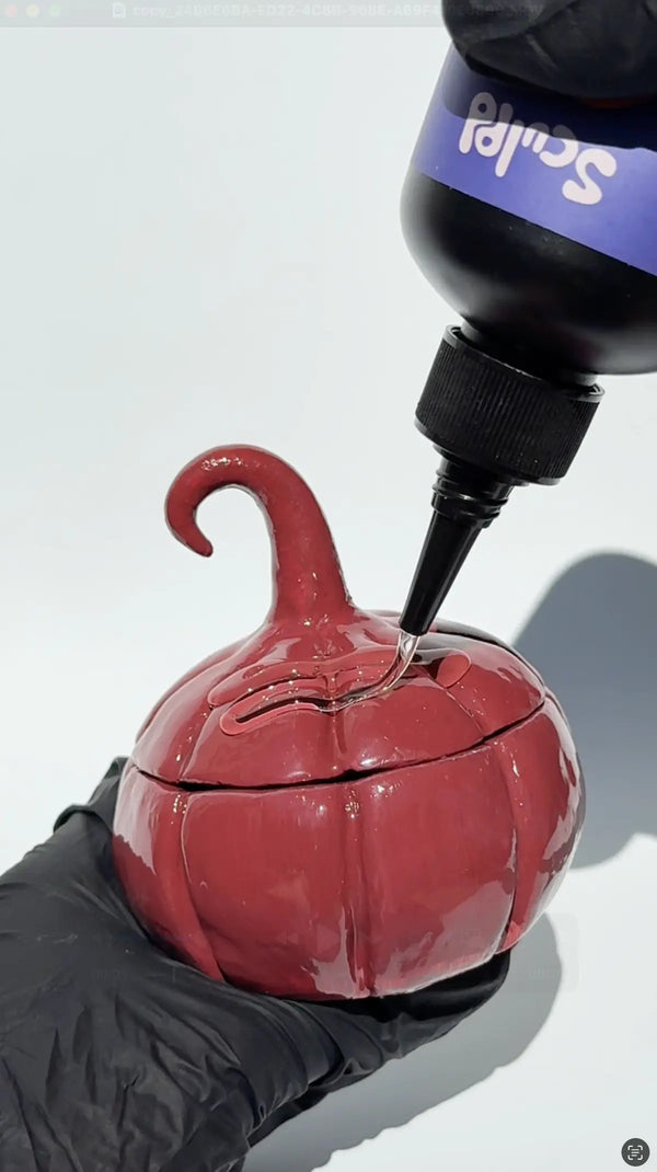 Applying Sculpd UV Resin in a pottery creation