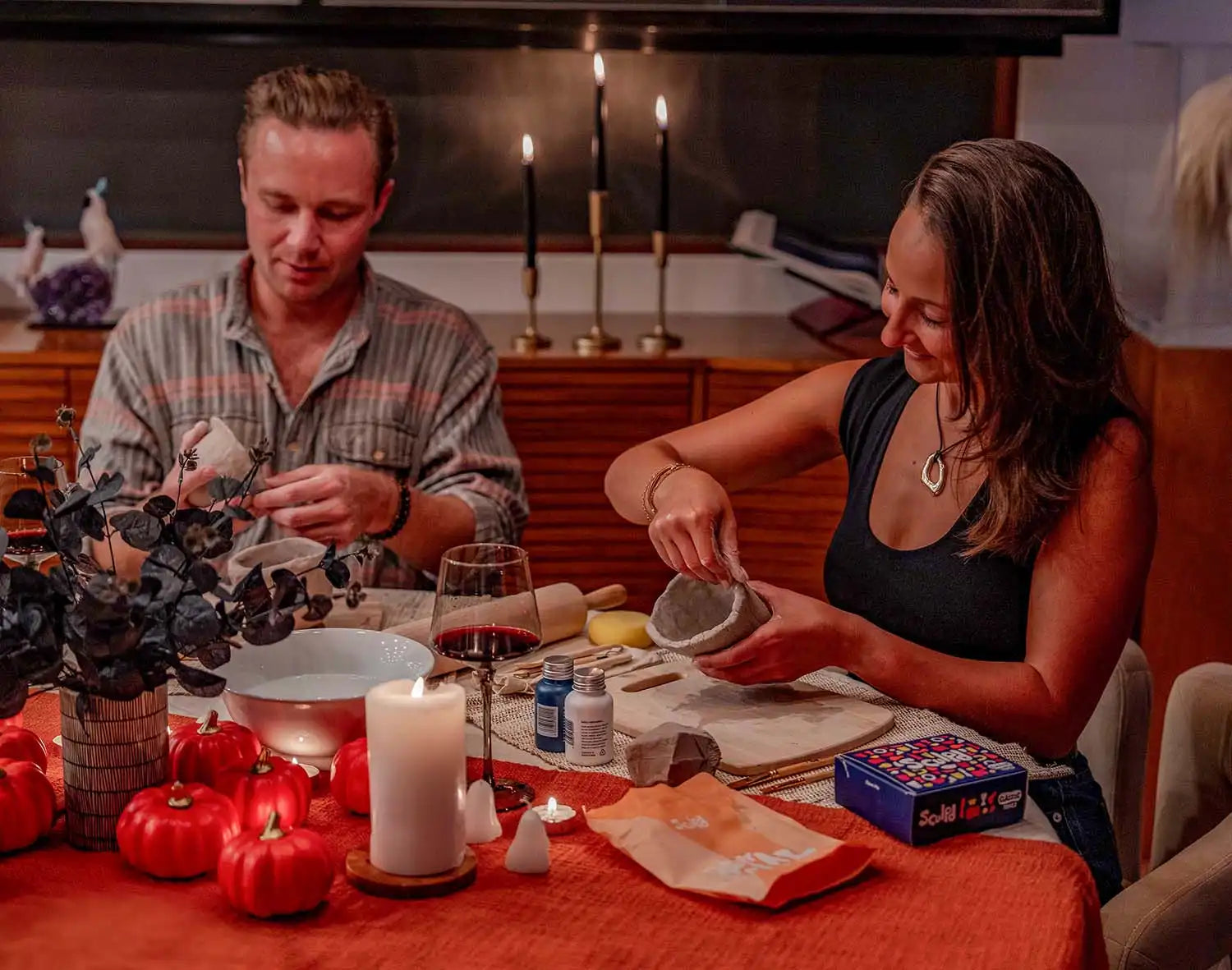 Couple sharing Halloween night with Sculpd Pottery Kit